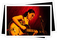 guitarist at amanda nightclub with red drop background