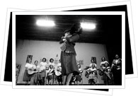 A lady dancing the 'la cueca sola' with supporting band